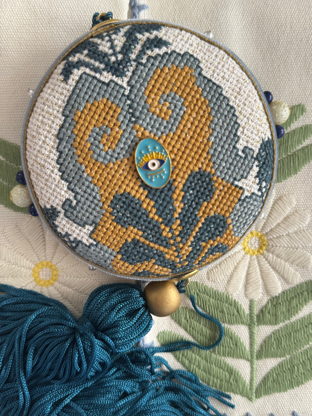 Hand  stitched round shaped charm🧿