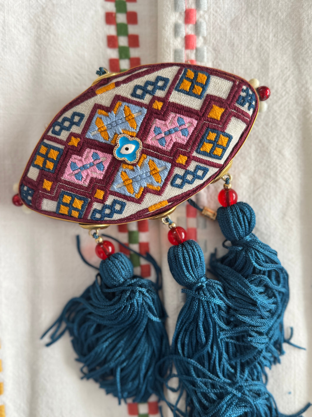 Eye shaped embroidered charm 💙